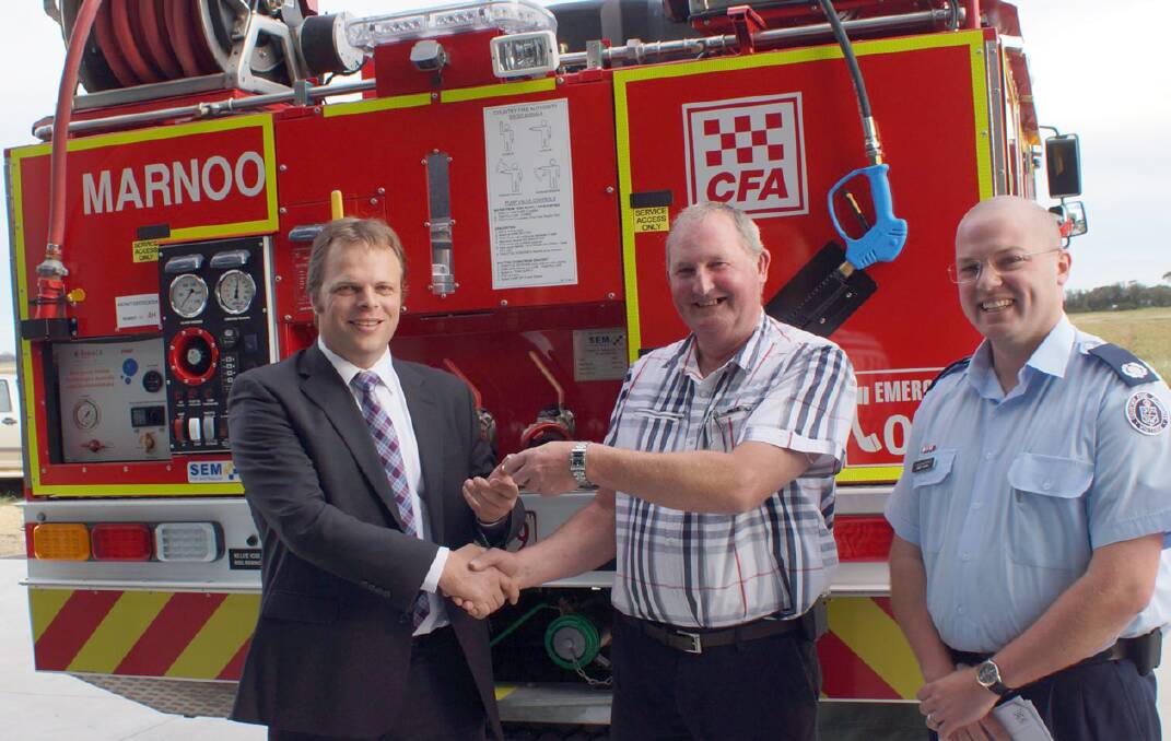 (L-R) Member for Western Victoria David O'Brien hands over the keys to the new tanker to Marnoo Fire Brigade captain, Lyle Johnson and David Harris from CFA Region 16. 
