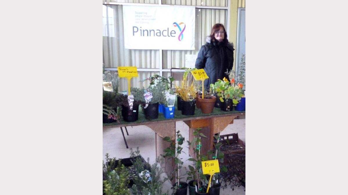 Pinnacle's Carleen Grace with some plants that will be for sale at Sunday's Farmers Market.