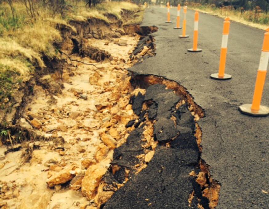The bitumen has caved in at some areas along Roses Gap Road, the result of flash
flooding following recent heavy rains. Pictures: CONTRIBUTED