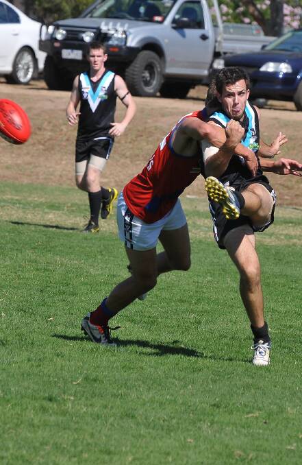 CKS Swifts Scott Carey gets a kick away during one of the team's early season clashes. Picture: MARK McMILLAN.