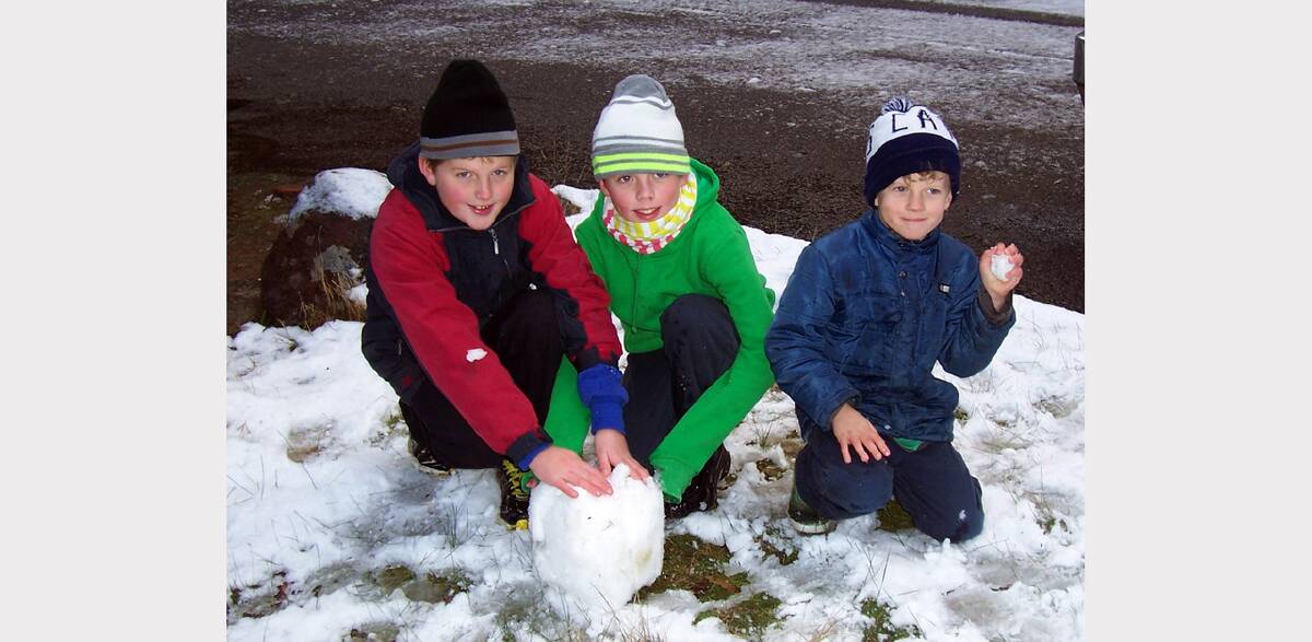 South Australian youngsters Elisha, Malachi and Silas from Kingston, enjoy playing in the snow on Mount William last Friday morning.