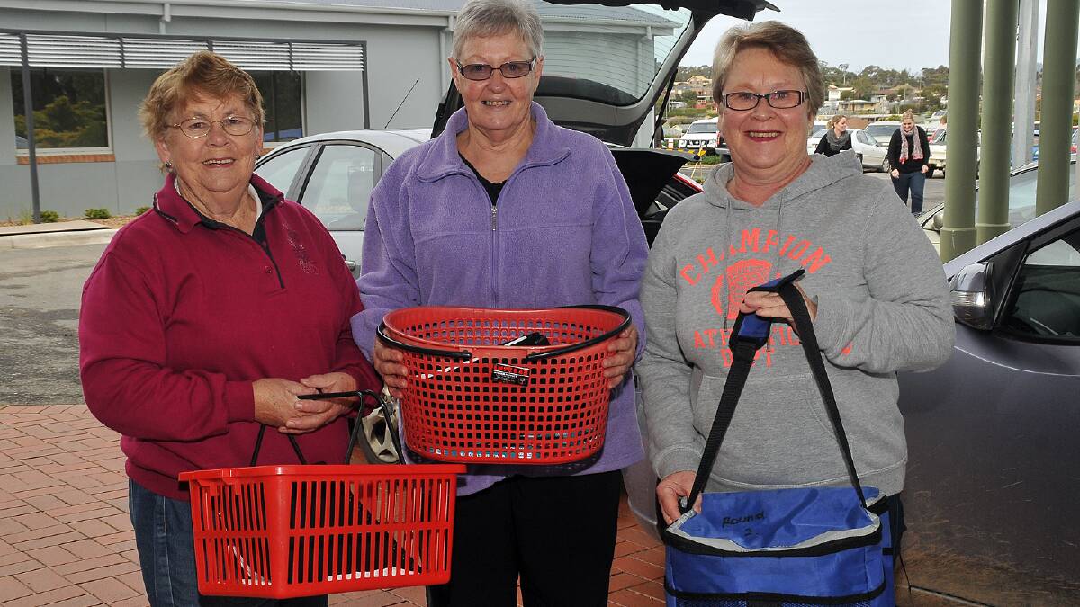Meals on wheels volunteers in Stawell (L-R) Marg Perry, Jo Bertram, and Jenny Gavin prepare for a delivery. Northern Granpians Shire Council is concerned over proposed funding changes for services such as meals on wheels. Picture:  KERRI KINGSTON.