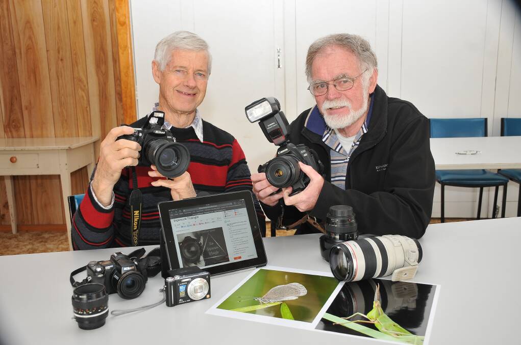 Stawell Camera Club members John Simpkin and John Tiddy, check their equipment as they prepare to conduct a short course in photography. Picture: KERRI KINGSTON