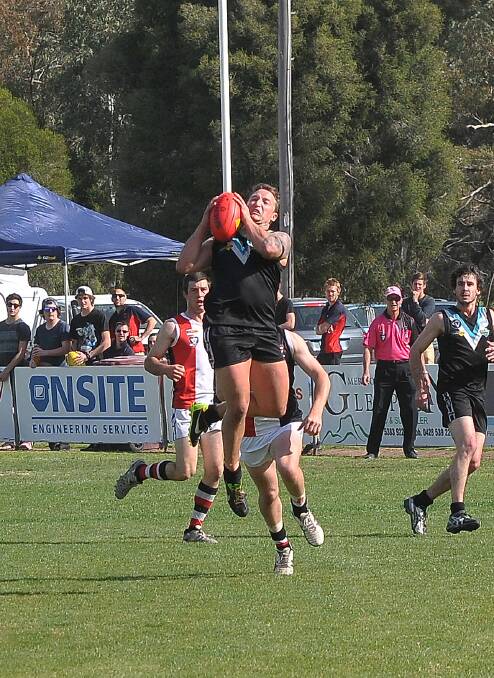 CKS Swifts forward Luke Mitchell played a key role in the Baggies first semi final win over Edenhope Apsley on Saturday. Taking this strong mark, the key forward kicked four goals in  the seven points win. Picture: MARK McMILLAN.