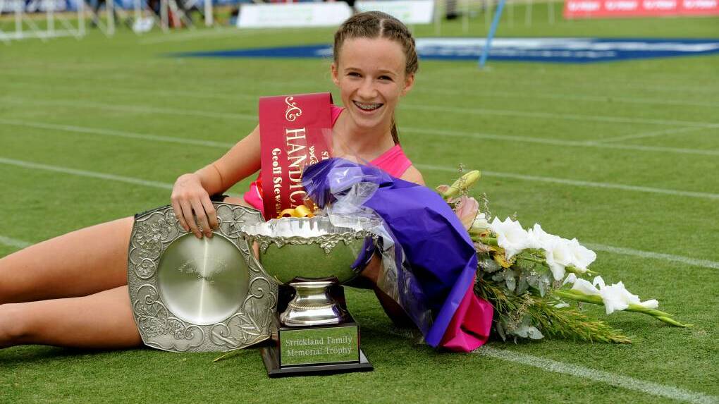 Talia Martin with her spoils after winning the women's Stawell Gift. Picture: PAUL CARRACHER
