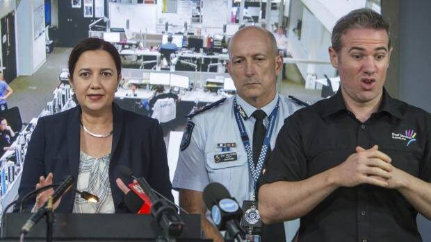 Interpreter Mark Cave, coined '#SignGuy' by media and social media, at the State Disaster Coordination Centre for a press conference with premier Annastacia Palaszczuk and emergency officials. Photo: Glenn Hunt
