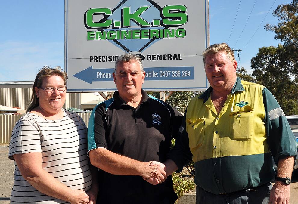 CKS Swifts Club president Ian O'Donnell (centre) with Carol and Tom Hedges from CKS Engineering, long term sponsors of the club. Picture: Kerri Kingston