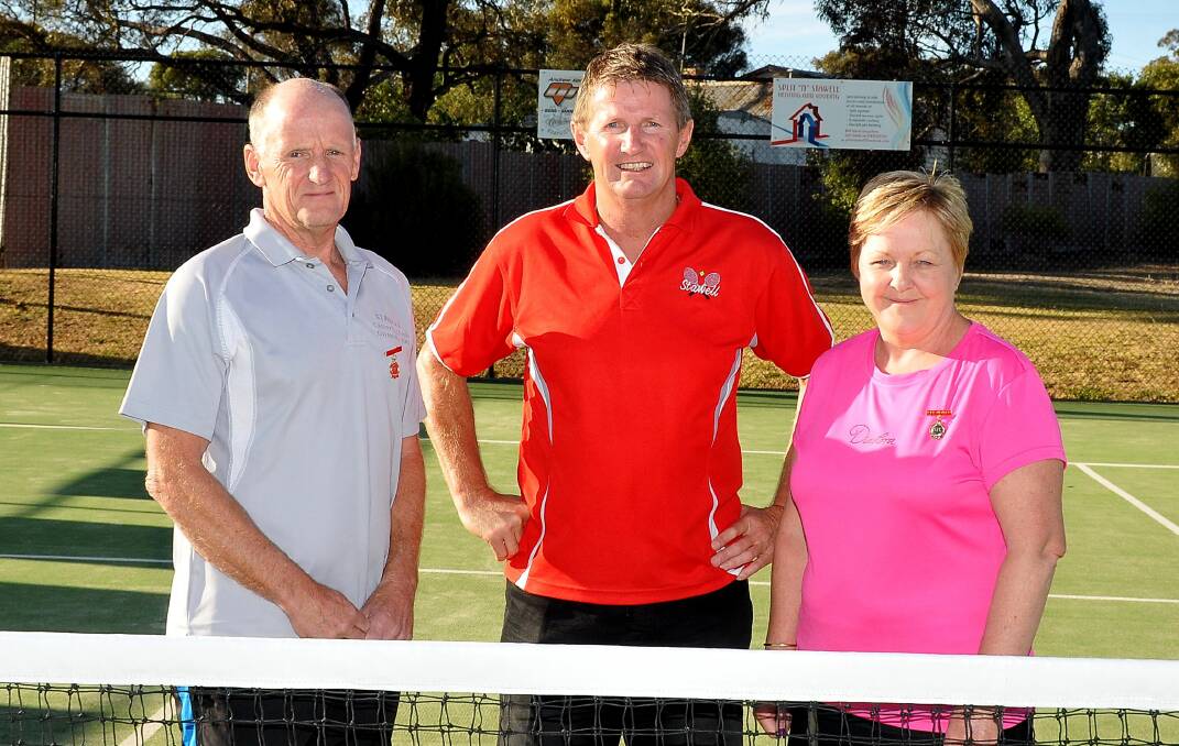 Stawell Tennis Club president Mark Stainsby (centre) congratulates the club’s two new life members Howard Dunn and Sue Blakey. Picture: Mark McMillan
