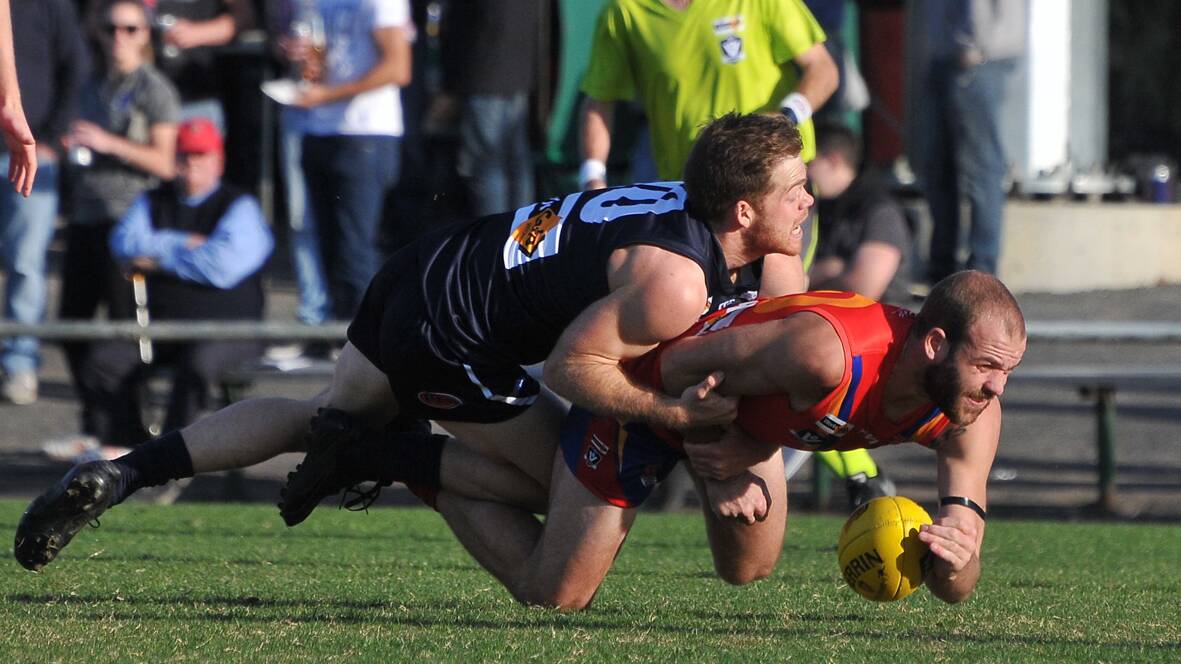 Stawell Warriors Wimmera Football League representative David Morris laid a sollid tackle on his Bellarine Football League opponant during the Worksafe Interleague clash at Horsham on Saturday. Picture: Mark McMillan