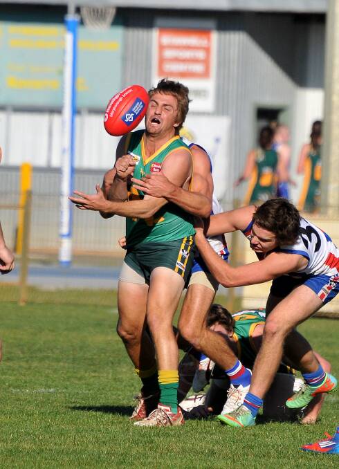 Daniel Parkin is tackled as he attemped a handball in the weekend's match against Avoca.