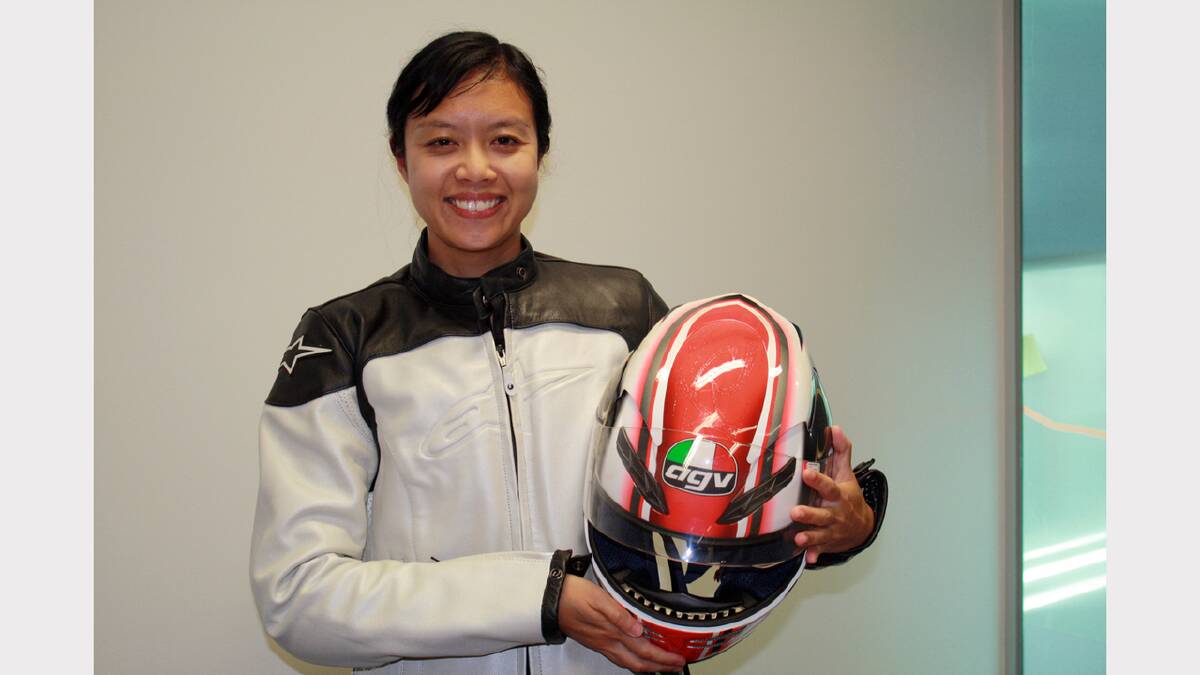 TAC's Road Safety project manager Jessica Truong takes a look at one of the helmets.