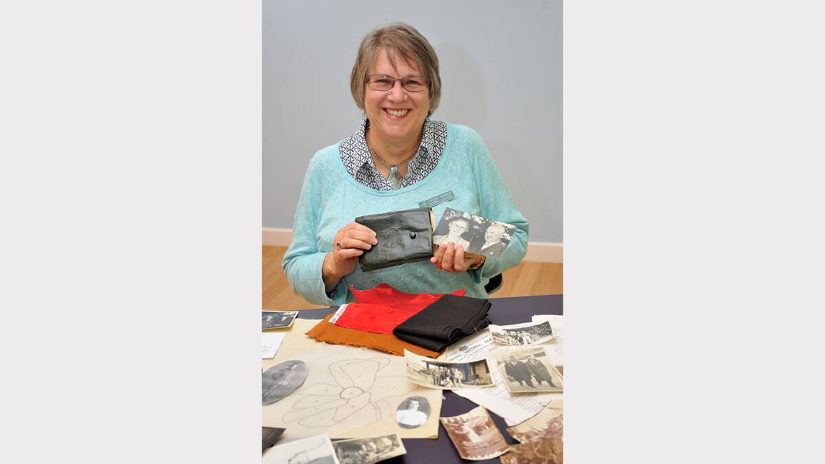 Helen Searle with some of the memorabilia she used as inspiration for her quilt.
