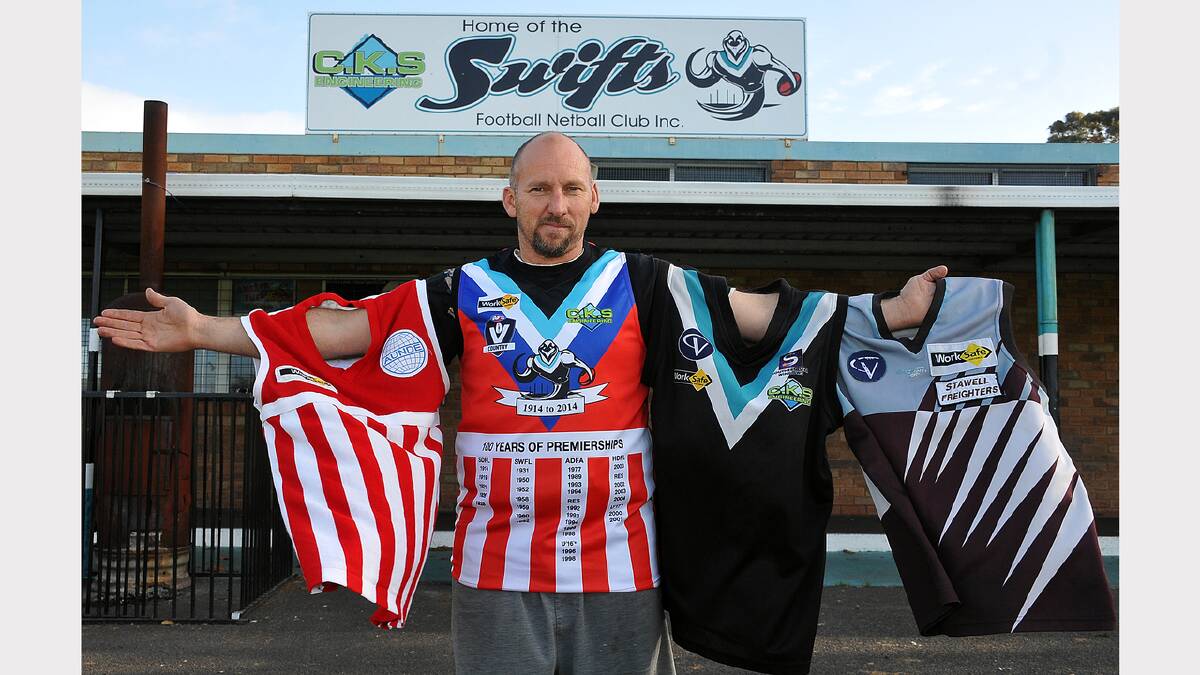 Jamie Britten with four of his five Swifts jumpers he has worn over the years.