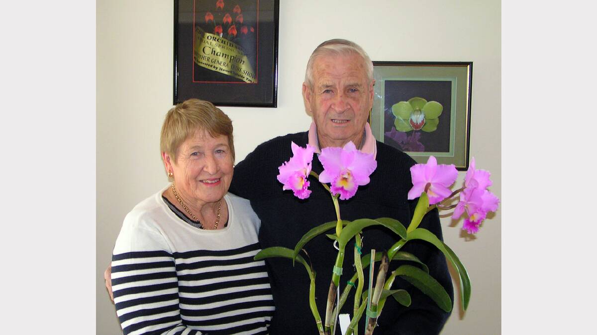 Val and Max Kennedy with one of their orchids that will be on display at the Summer Show.