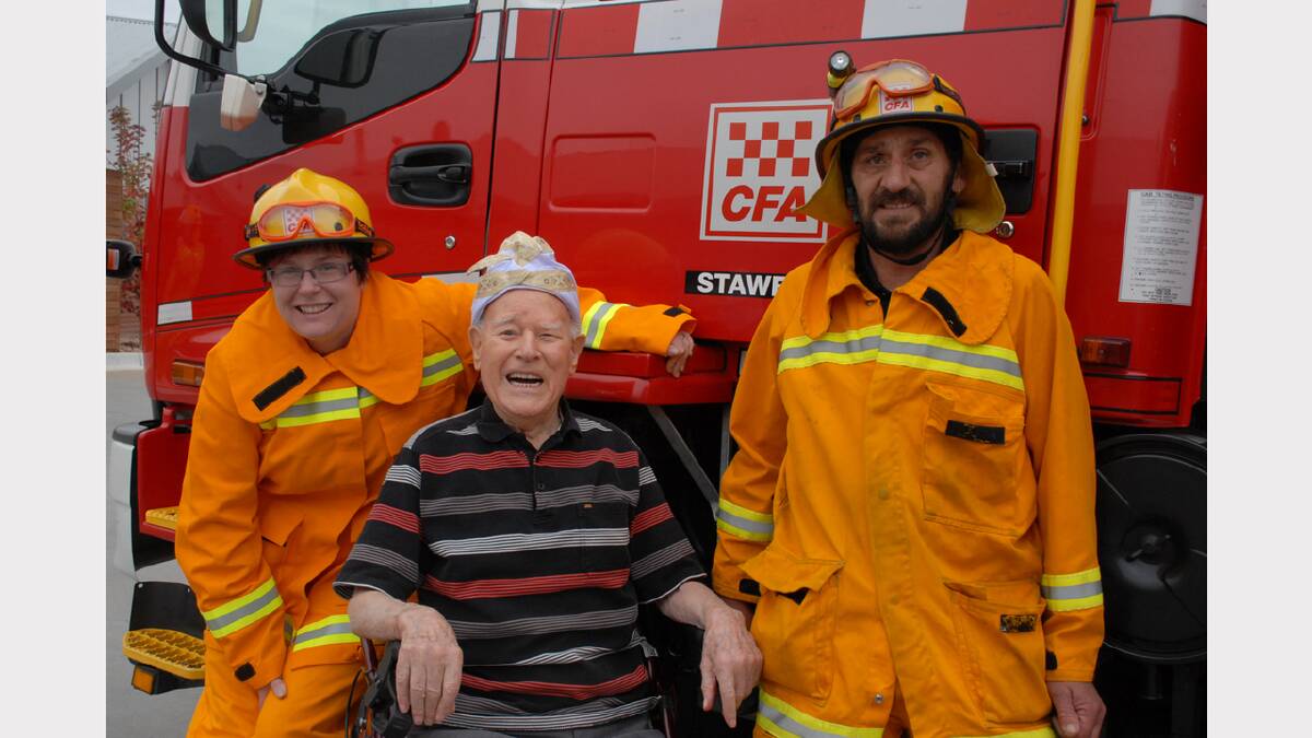 Centenarian Bob McKee shares a light-hearted moment with Stawell Fire Brigade volunteers Chantelle Cook and Geoff Fletcher, after they responded to an alarm set off by the candles being lit on Bob's birthday cake. More photos in the Stawell Times News Gallery.