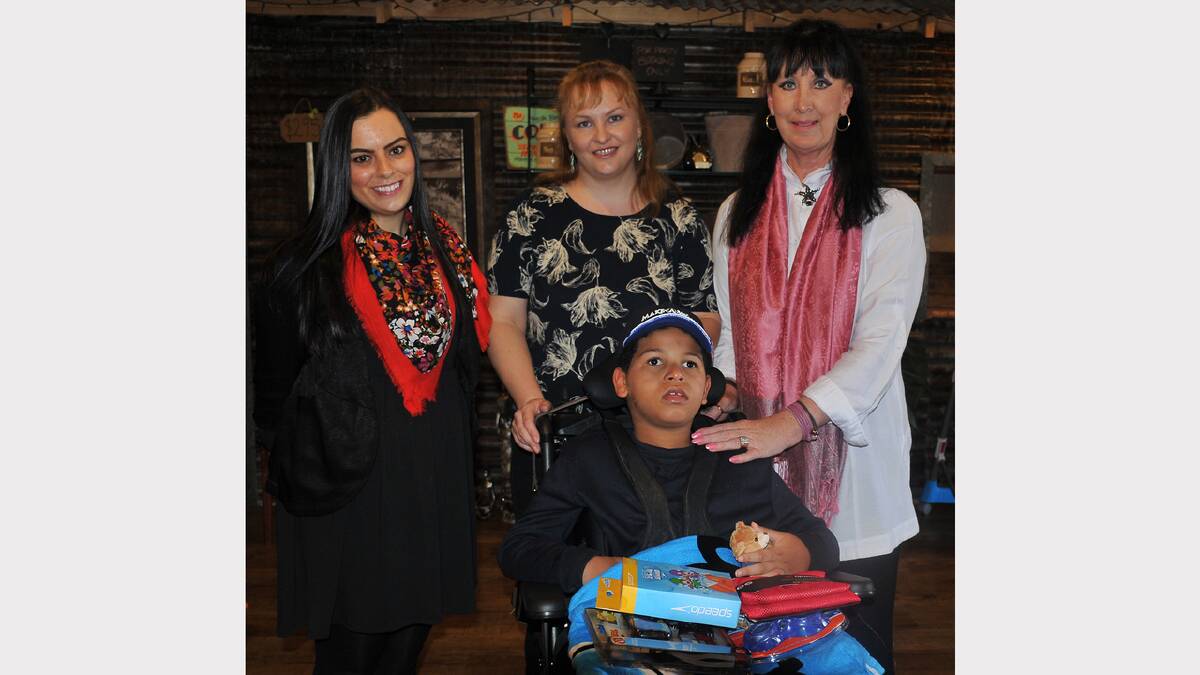 Ibitari and his mum Kim are pictured at Lillies and Latte in Stawell with Amiee Jones (left) and Lisa Murray (right) from the Make A Wish Foundation.