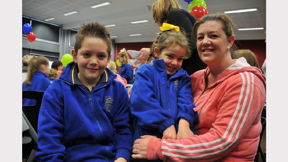 Jed and Alyra enjoy the breakfast with their mum Nicole Murray.