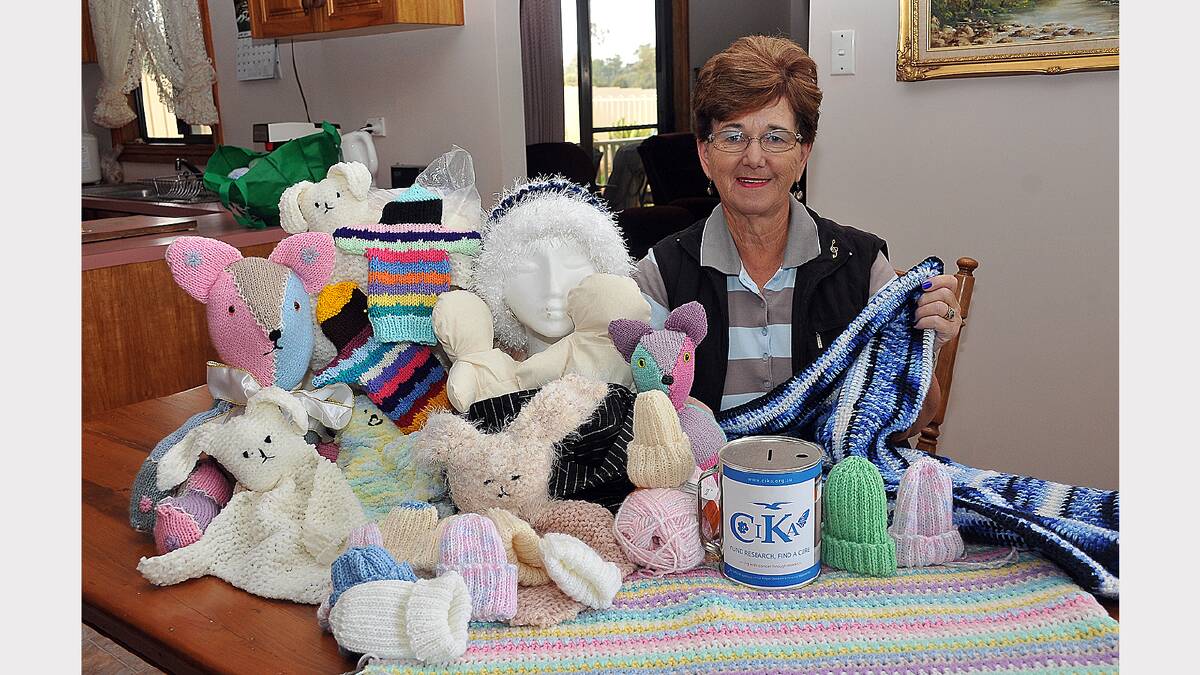 Carmel Loats with some of her handmade teddy bears, blankets and beanies to support the Royal Children's Hospital and Save The Children Australia.