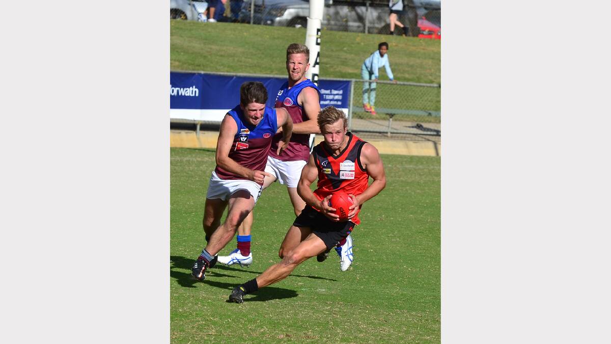 Stawell Warriors onballer Tom Eckel breaks clear of his Horsham Demons opponent in Saturday's opening round clash at Central Park.