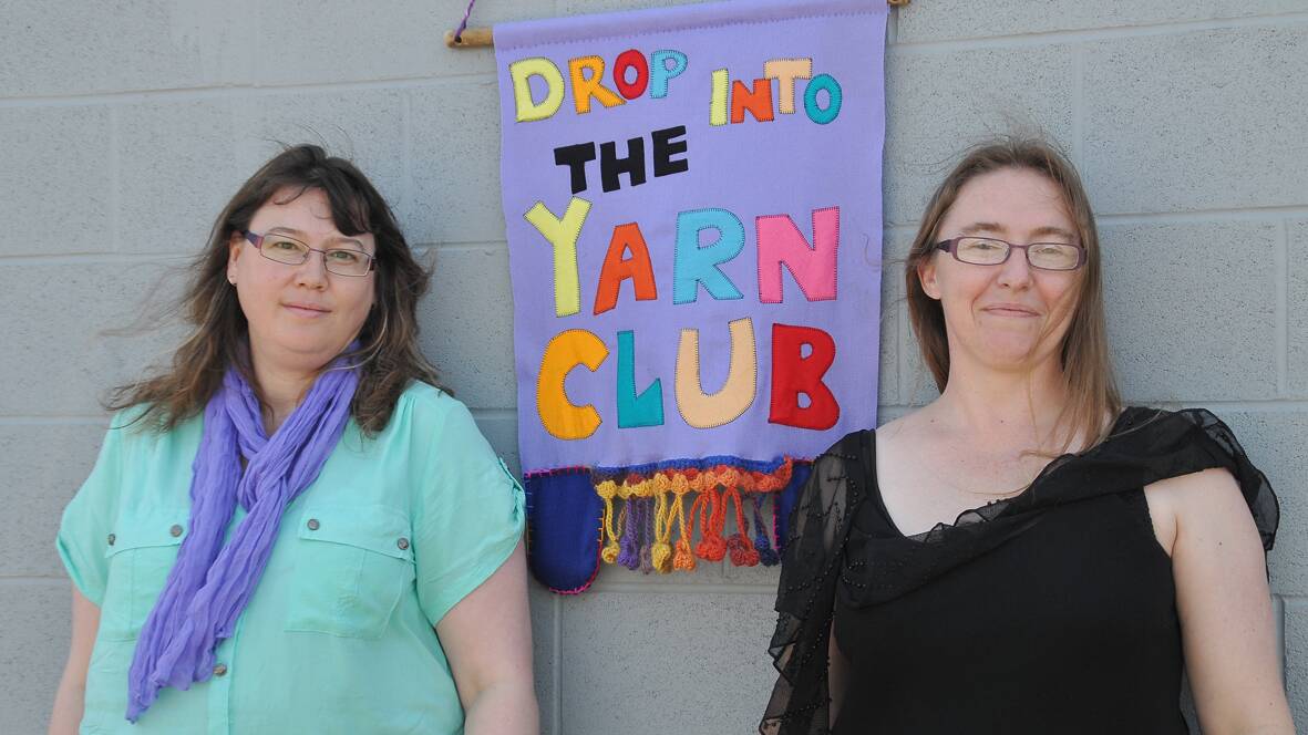 Stawell Yarn Club members Michelle Kloester and Bernadette Welsford with
the invitation banner outside the Salvation Army function room. 