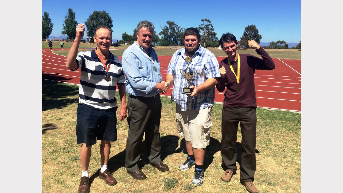 Amateur Athletics members Bob Freeland (left) and Keith Lofthouse (right) with Mayor Cr Murray Emerson and StawellBiz president Chris Waack, with the StawellBiz Cup.