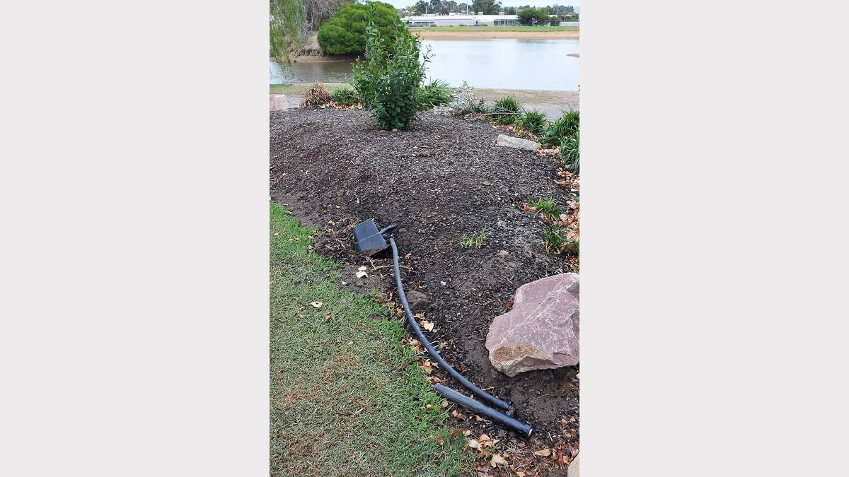 Irrigation pipes are left laying on the ground at Cato Park.