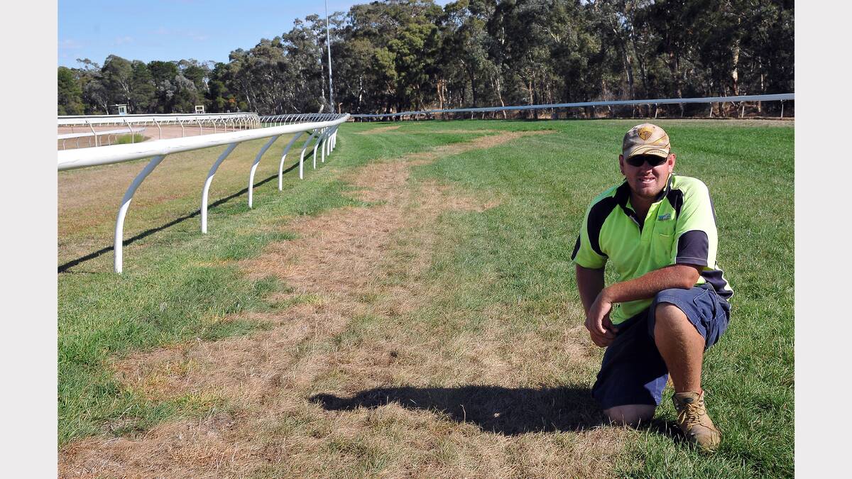 Stawell Racing Club's track and facilities manager Chris Grayham with a damaged section of the Stawell track.