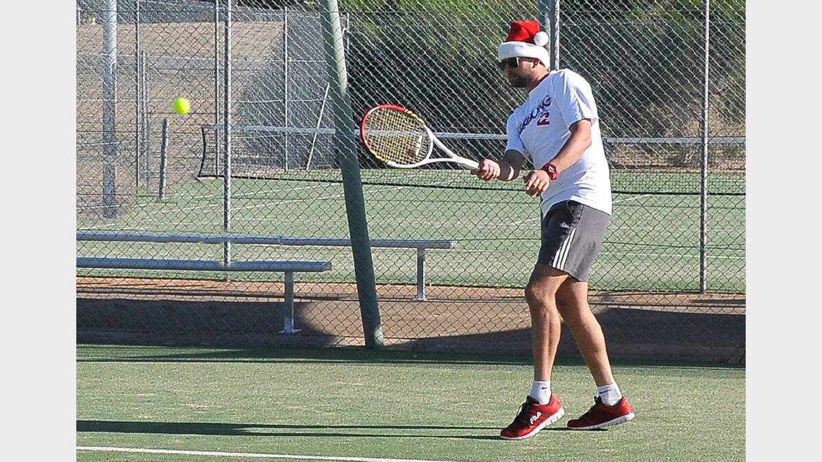 Ben Martin donned his Christmas hat as he lined up for Cassidy Painting in the Stawell tennis competition on Friday night.