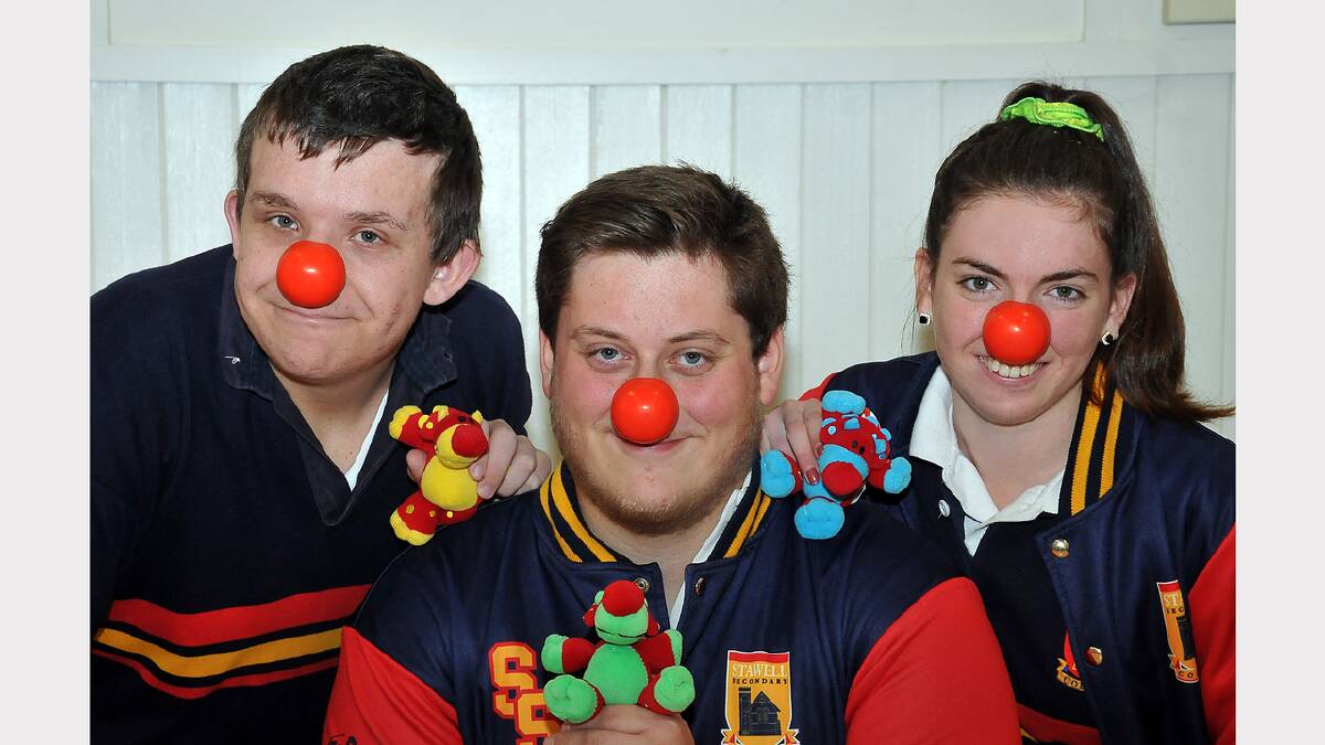 College students Tom, Rowen and Bridget with their red noses.