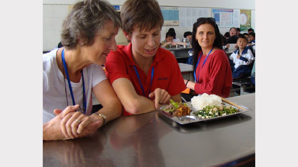 Heather and Tom Fleming inspect a lunch tray with Sarah Lind of Geelong looking on.
