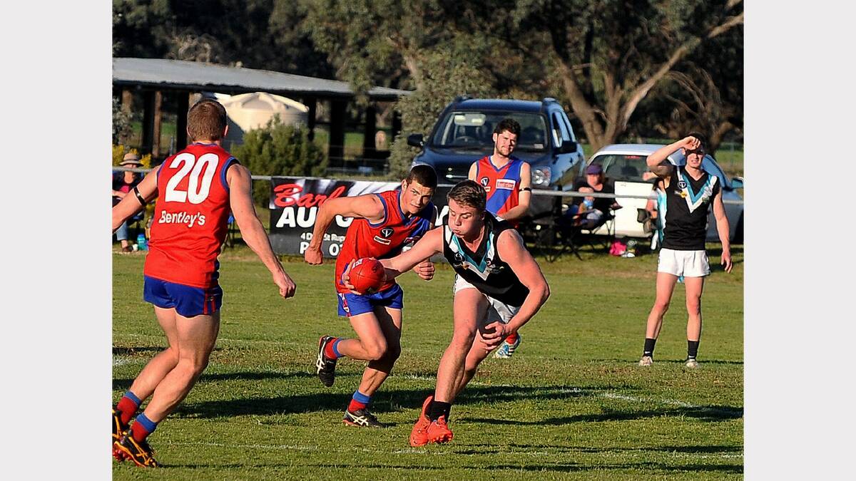 Zach Salmi gathers in the football to send CKS Swifts into attack in the preliminary final clash against Kalkee on Saturday.