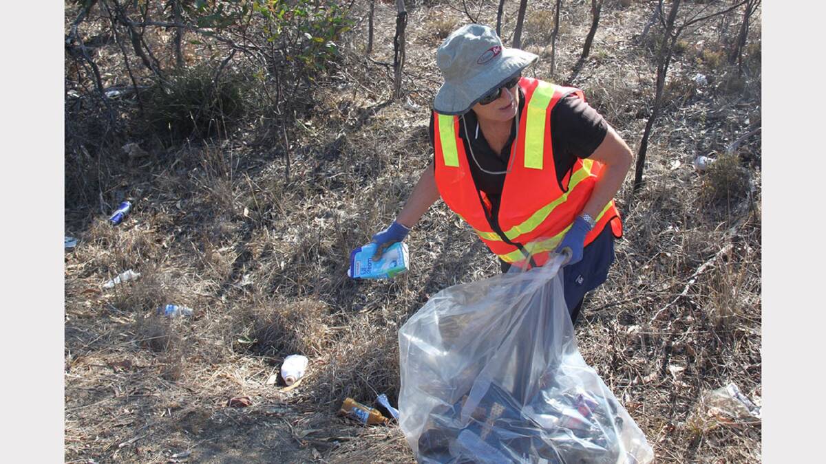 Volunteer Penny Earle cleans up on the Western Highway in Stawell.