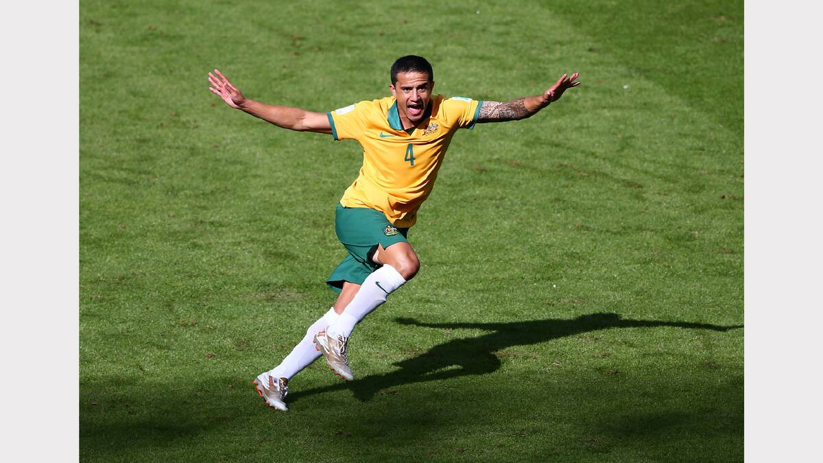 Socceroos striker Tim Cahill celebrates Australia's first goal in this morning's clash against the Netherlands. Photo: Getty Images