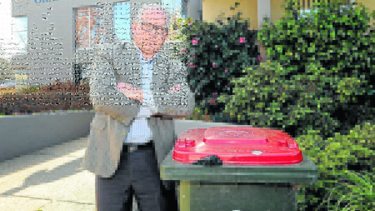 CLAYTON’S TRIAL: Orange councillor Jeff Whitton says council had already locked into fortnightly red bin collection despite staging a six-month trial of the reduced service. Photo: STEVE GOSCH 								                              