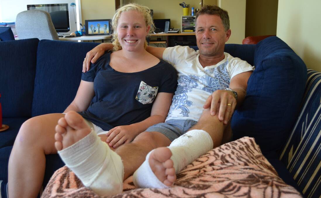 Rhianna Brown with her father Jeff who was bitten by a shark on Monday morning. Photo by Jess Long.