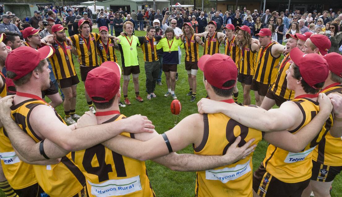 A HAPPY TEAM AT TATY: Tatyoon’s reserves sing the club song after winning their fourth premiership in five years.