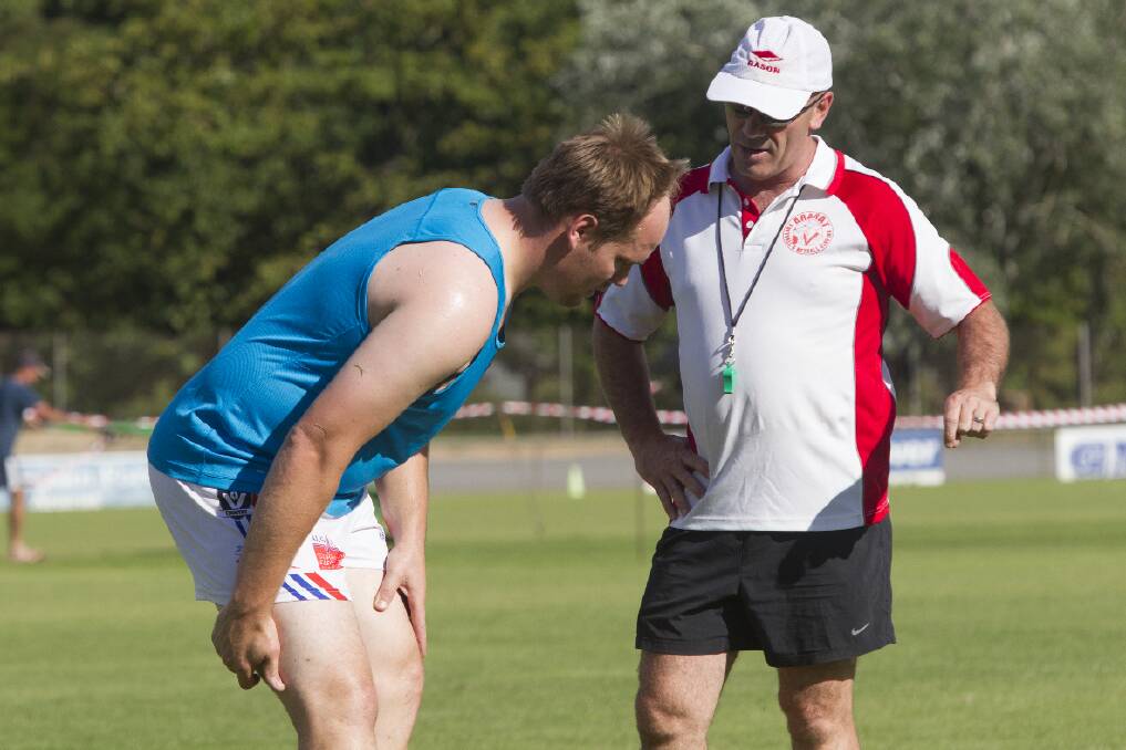 David Hosking (right) chats with new recruit and assistant coach David Brady
during pre-season fitness testing.