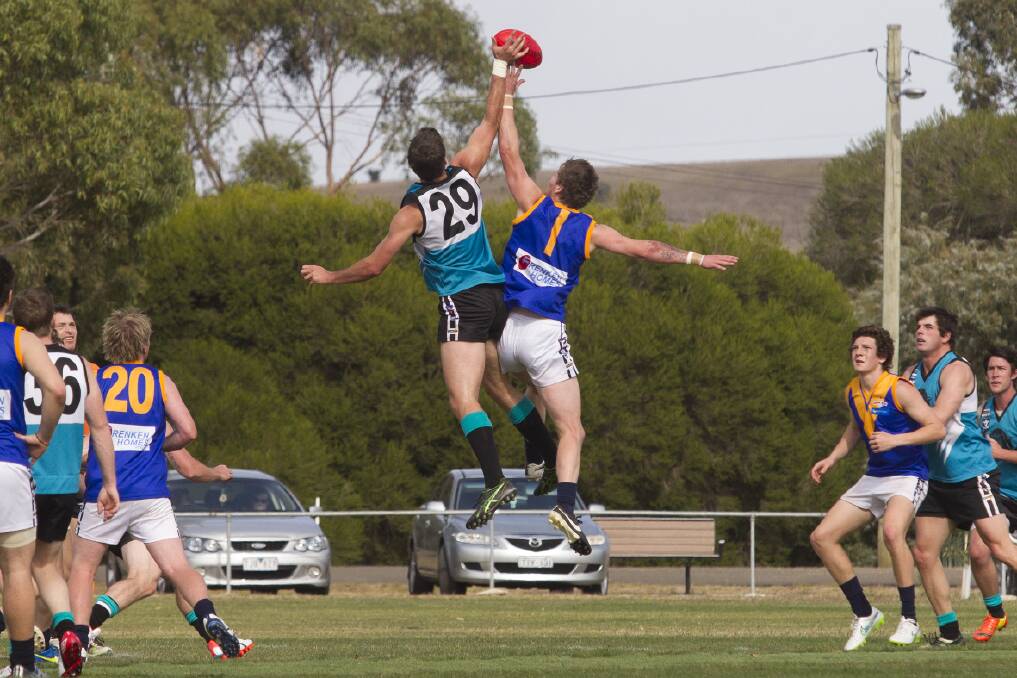 Ruckmen Josh Bywater (Moyston/Willaura) and Nick Bulger (Ararat Eagles) get plenty of air during a centre bounce last week.