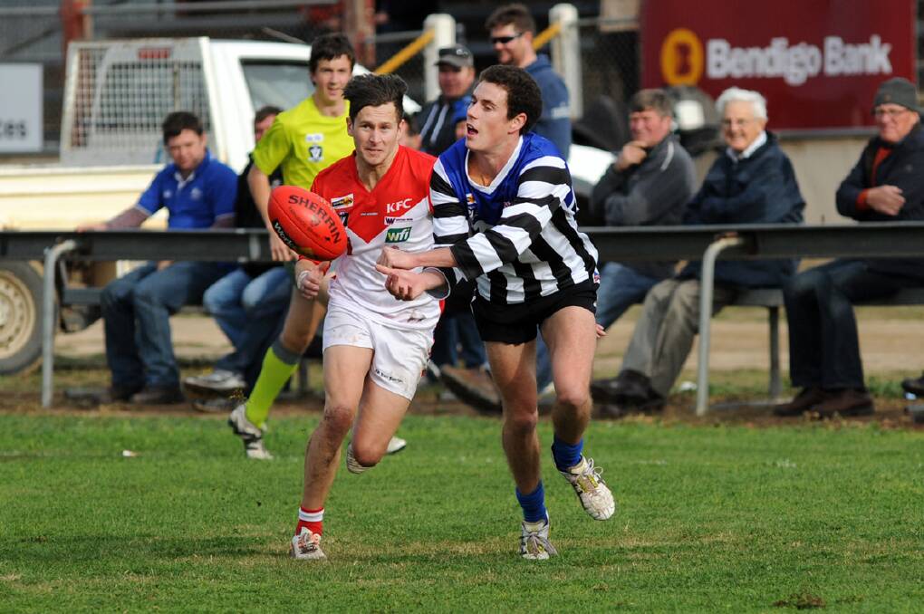 Ararat skipper Alan Batchelor puts pressure on Minyip/Murtoa’s Xavier Kelly during Saturday’s Wimmera Football League match. Batchelor was named among the Rats’ best in the 40-point loss. Picture: PAUL CARRACHER