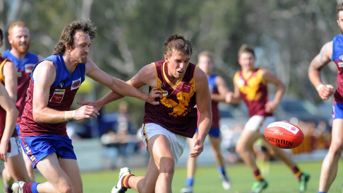 Jake Peters fights off Horsham's Mick O'Callaghan as the pair hunt the ball during the 2014 Wimmera Football League season.