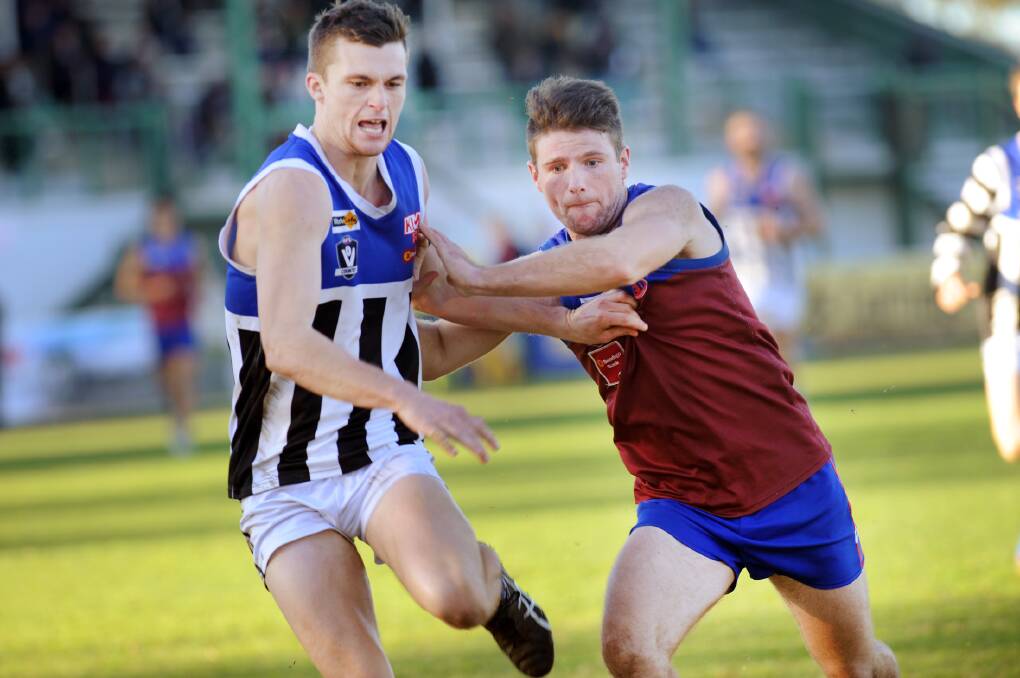 GOOD CONDITION: Jae McGrath and Darcy Taylor battle for the ball at Horsham's City Oval. The ground has remained in good condition despite recent wet weather. Picture: PAUL CARRACHER