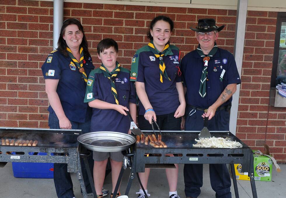 Pictured cooking up a storm at the initial information session on resurrecting Scouts in Stawell are (L-R) Kimberley, Nicholas and Claire Rolls, along with 'Gunner'. Picture: MARK McMILLAN.
