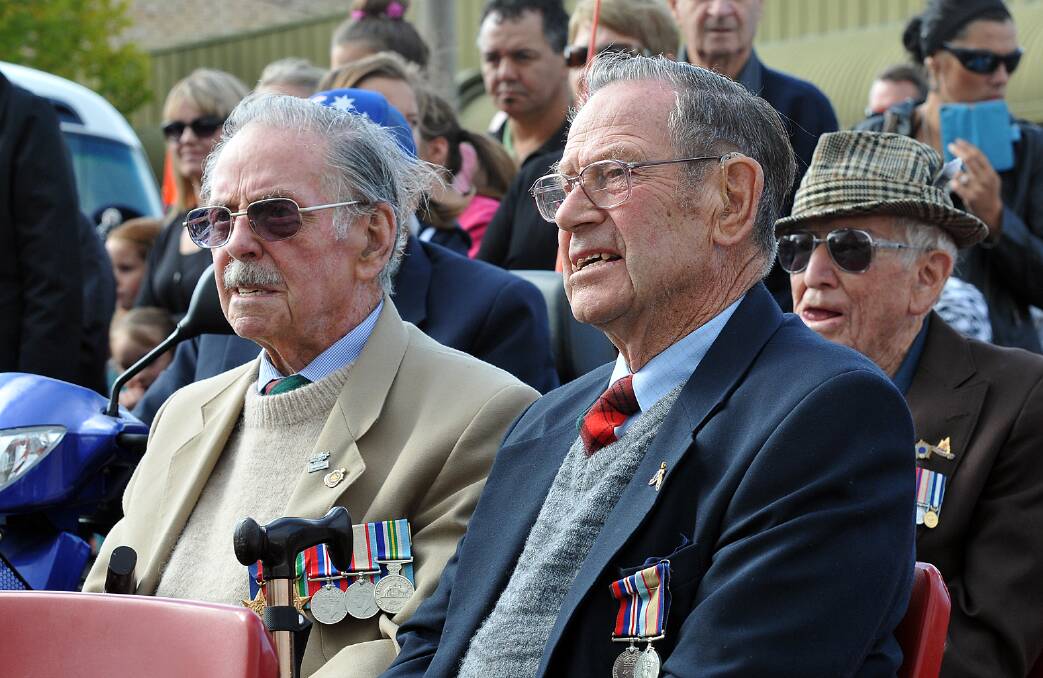 Brothers Hugh and Jim Stewart watch on as the formal part of the Stawell Anzac Day commemoration takes place.