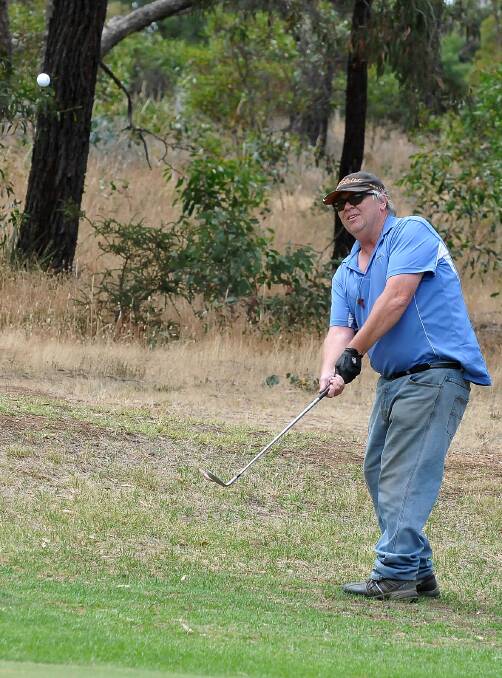 Craig Allan, who was part of the winning combination in the Deep Core Drilling Summer Championship at the Stawell Golf Club on Saturday, is pictured chipping up towards the green. Picture: MARK McMILLAN.