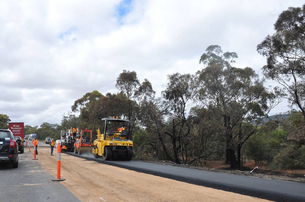 Works are being undertaken to repair the bitumen badly damaged in the fiery crash. Pictures: BEN KIMBER