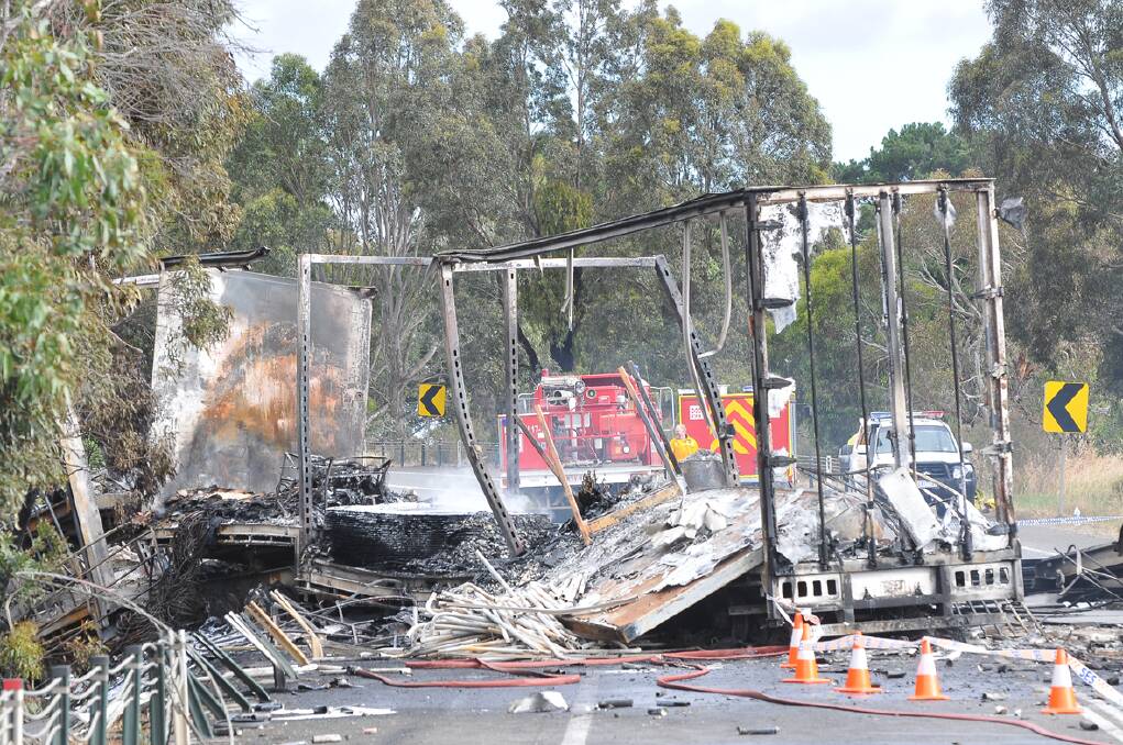 A stretch of the Western Highway was badly damaged in the inferno that followed the crash.