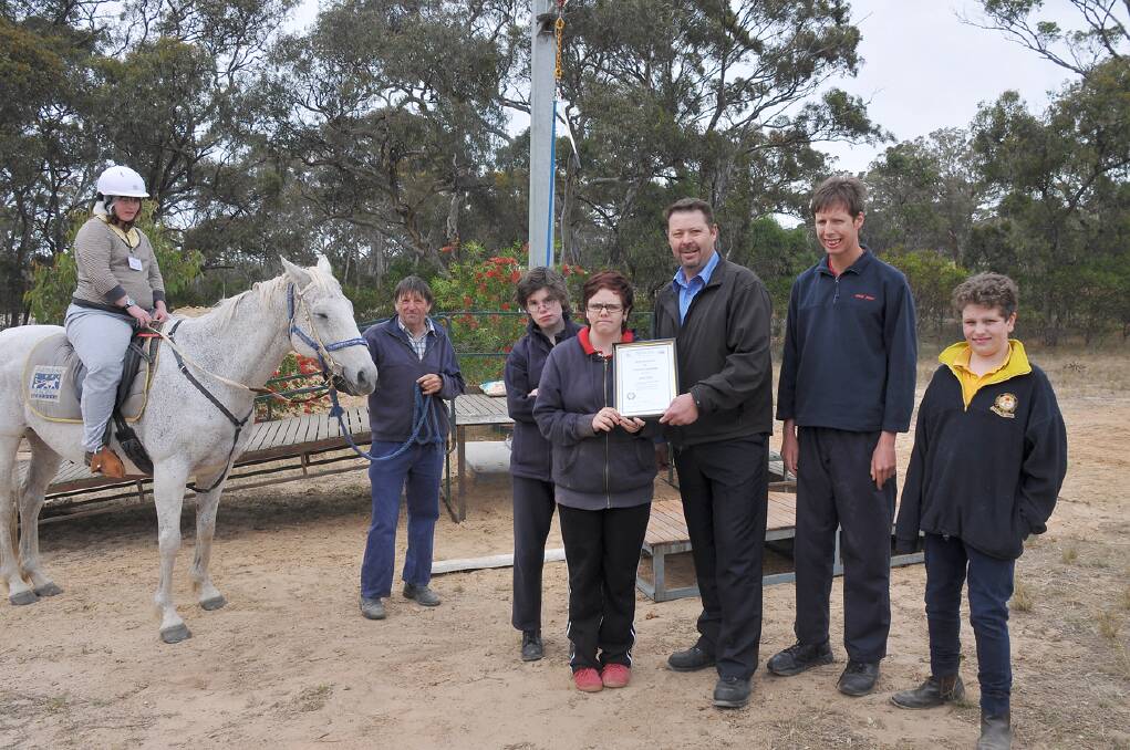 Pictured at the presentation of certificates at Stawell Riding for the Disabled (L-R) Hannah, Hugh O'Sullivan, Ashlee, Holly, Mine General Manager Troy Cole, Tom and Blake. Picture: MARCUS MARROW.