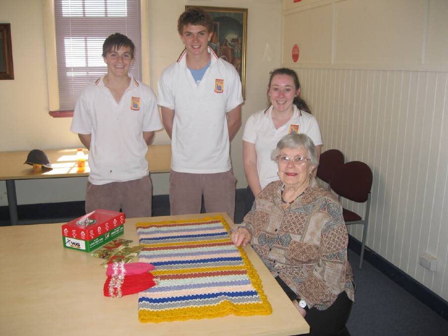 (L-R) Sam Raeck, Nick Raeck and Megan Hodgetts are pictured thanking Lesley Bennett for some of the items she donated for the trip. 