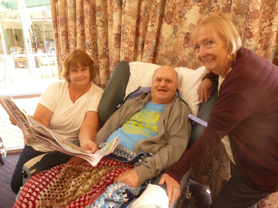 Volunteers Robyn Work (left) and Karen Dudley (right) are pictured at the nursing home with resident Kevin. 