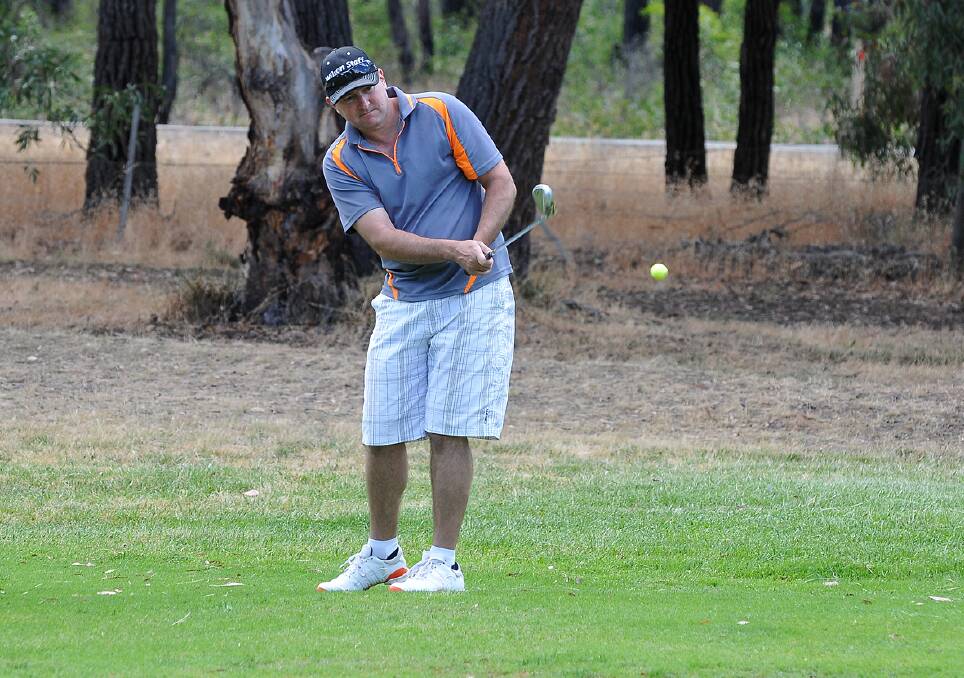 Jason O'Hayen is pictured chipping towards the green during his round of the Summer Fourball Championships in Stawell. Picture: MARK McMILLAN.